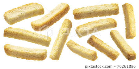 White bread croutons, salted bread sticks isolated on white background White bread croutons, salted bread sticks isolated on white background 76261886