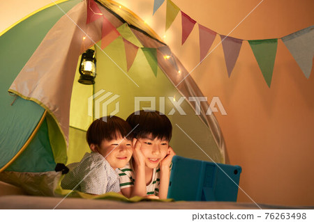 Boys enjoying home camp Boys enjoying home camp 76263498