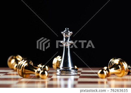 Silver queen chess defeats gold pawns on board. 76263635