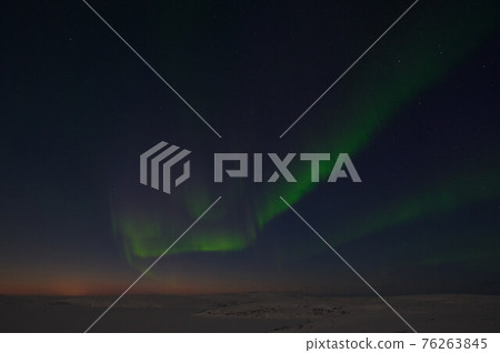 northern light on the silent field before sun rise. northern light on the silent field before sun rise. 76263845