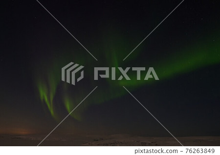 northern light on the silent field before sun rise. 76263849