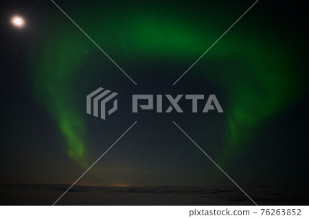 northern light on the silent field before sun rise. northern light on the silent field before sun rise. 76263852