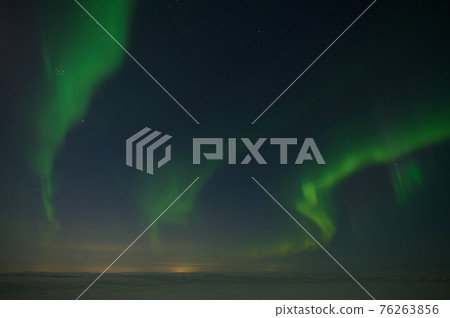 northern light on the silent field before sun rise. northern light on the silent field before sun rise. 76263856