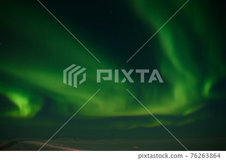 northern light on the silent field before sun rise. northern light on the silent field before sun rise. 76263864