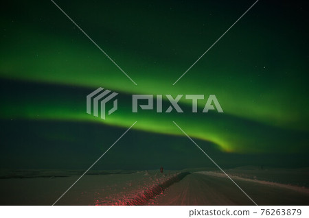 northern light on the silent field before sun rise. northern light on the silent field before sun rise. 76263879