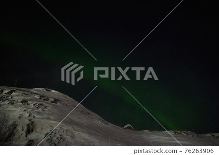 northern light on the silent field before sun rise. northern light on the silent field before sun rise. 76263906