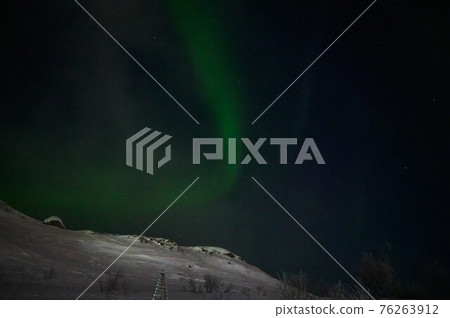 northern light on the silent field before sun rise. northern light on the silent field before sun rise. 76263912