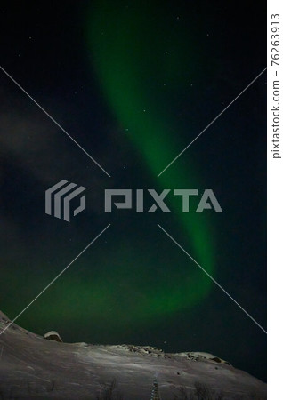 northern light on the silent field before sun rise. northern light on the silent field before sun rise. 76263913