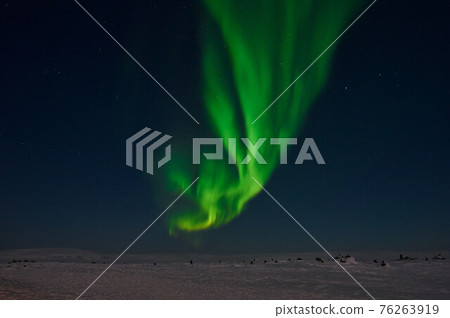 northern light on the silent field before sun rise. northern light on the silent field before sun rise. 76263919