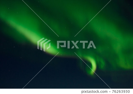 northern light on the silent field before sun rise. 76263930