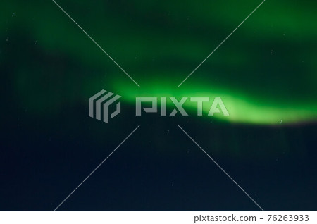 northern light on the silent field before sun rise. 76263933