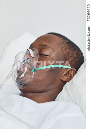 African American Man with Oxygen Support in Hospital 76264660
