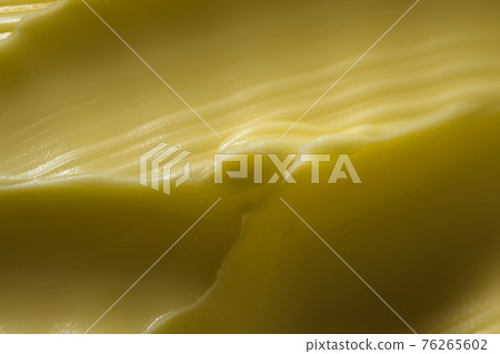 Ridge of margarine makes a dramatic super macro image. Ridge of margarine makes a dramatic super macro image. 76265602
