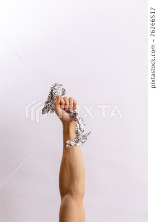 Hands hold trash on a light background. The concept of separate trash, stop plastic, recycling Hands hold trash on a light background. The concept of separate trash, stop plastic, recycling 76266517