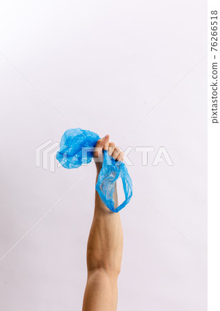 Hands hold trash on a light background. The concept of separate trash, stop plastic, recycling Hands hold trash on a light background. The concept of separate trash, stop plastic, recycling 76266518