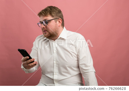 a man with glasses talks on video communication and swears, not happy, upset. Video conference 76266628