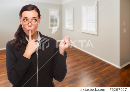 Woman In Empty Room of New House 76267927