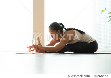 Asian woman pilates exercise yoga in home. Asian woman pilates exercise yoga in home. 76268444