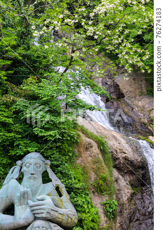 Waterfall and monument of St. Andrew near Sarpi town in Adjara, Georgia Waterfall and monument of St. Andrew near Sarpi town in Adjara, Georgia 76274183