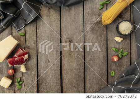 Italian cuisine concept. Parmesan Cheese chunk, pasta, sliced ham, tomato, basil 76278378