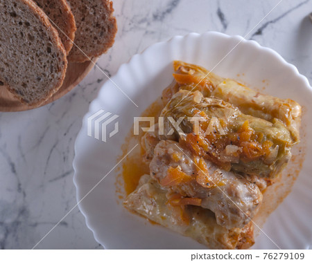 Stuffed cabbage rolls in cabbage leaves. 76279109