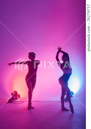 The two modern ballet dancers in black and red bodysuit, studio The two modern ballet dancers in black and red bodysuit, studio 76279717