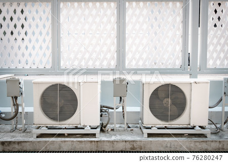 Cooling Air Condition Unit and Control System, Air Condenser Engine Station Outside Building of HVAC Systems. Electrical Compressor Fan Coil of Air Conditioning Equipment for Home Residential Units. Cooling Air Condition Unit and Control System, Air Condenser Engine Station Outside Building of HVAC Systems. Electrical Compressor Fan Coil of Air Conditioning Equipment for Home Residential Units. 76280247