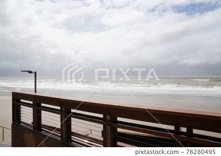 A Wet And Stormy Day On The Beach 76280495