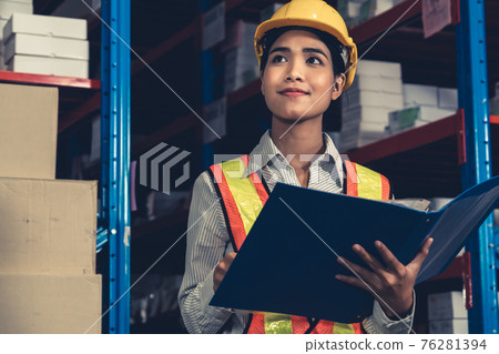 Female warehouse worker working at the storehouse 76281394