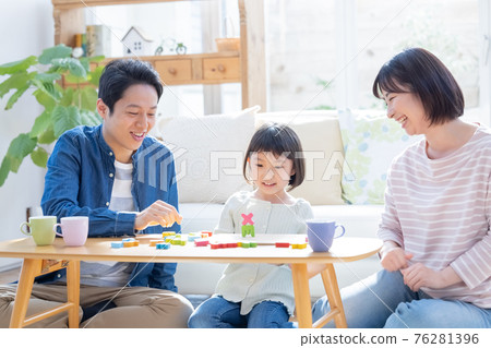 Family Enjoying home time while playing with blocks 76281396