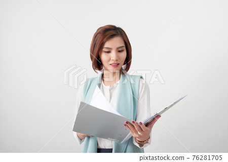 elegant business woman with clipboard on light office background 76281705