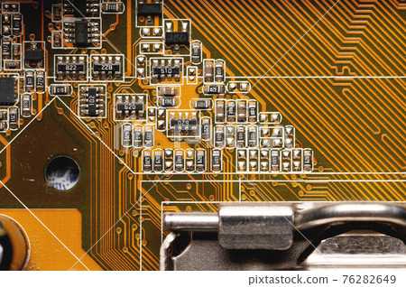 close-up of a printed circuit board with microchips and radio parts with a processor. Background for electronics close-up of a printed circuit board with microchips and radio parts with a processor. Background for electronics 76282649