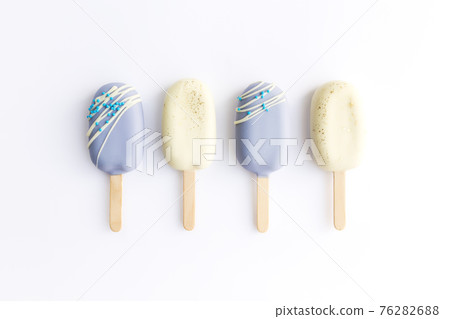 Blue and white cookie ice creams on a stick on white background 76282688