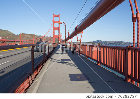 Parents and children walking north across the Golden Gate Bridge in San Francisco. Parents and children walking north across the Golden Gate Bridge in San Francisco. 76282757