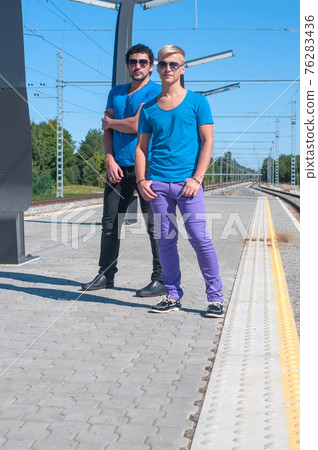 Shot of two young men standing on platform 76283436