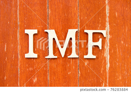 Alphabet letter in word IMF (abbreviation of International Monetary Fund) on old red color wood plate background Alphabet letter in word IMF (abbreviation of International Monetary Fund) on old red color wood plate background 76283884