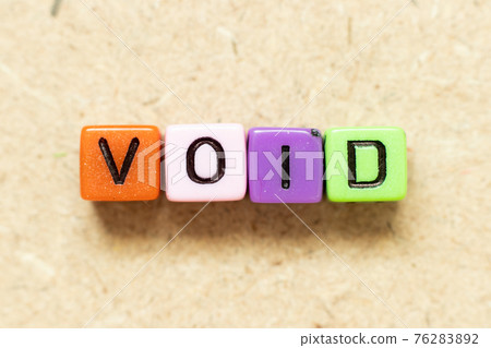 Color alphabet letter block in word void on wood background 76283892