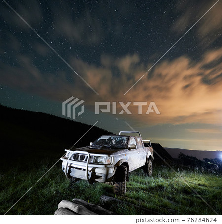 Dirty big car in forest or mountains. Dirty big car in forest or mountains. 76284624