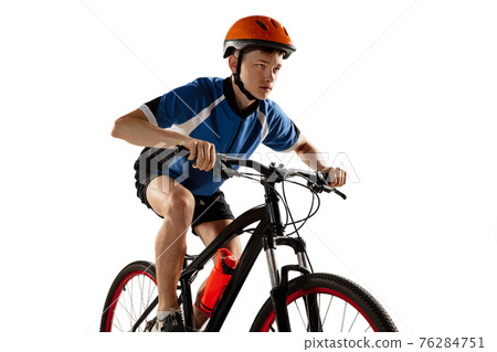 Young Caucasian boy bike rider on road bike isolated over white background. 76284751