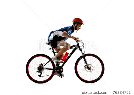 Young Caucasian boy bike rider with road bike isolated over white background. Young Caucasian boy bike rider with road bike isolated over white background. 76284791