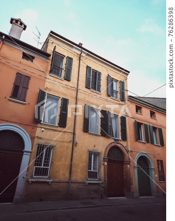 Traditional italian house with shutters on street Traditional italian house with shutters on street 76286398