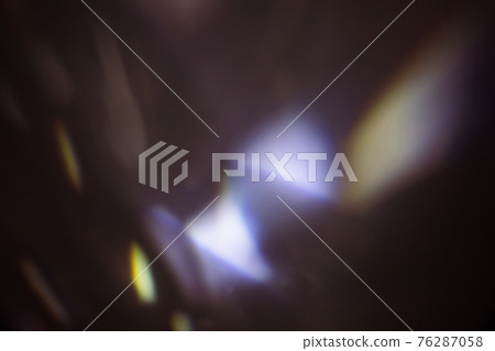 colorful warm rainbow light leaks on black background with dust texture 76287058