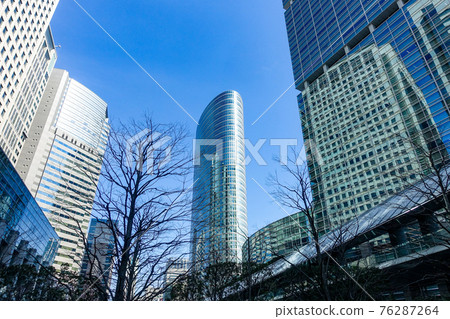 Skyscrapers of Shinagawa Intercity towering over the blue sky 76287264