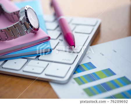 Business image · graph · keyboard · notebook · female Business image · graph · keyboard · notebook · female 76289692