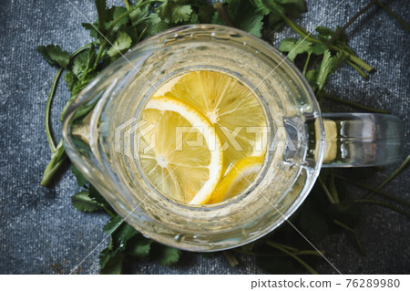 Lemonade in a glass decanter Lemonade in a glass decanter 76289980