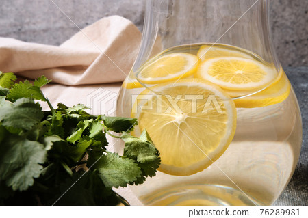 Lemonade in a glass decanter Lemonade in a glass decanter 76289981