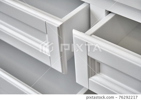 White wooden dresser in classical style closeup White wooden dresser in classical style closeup 76292217