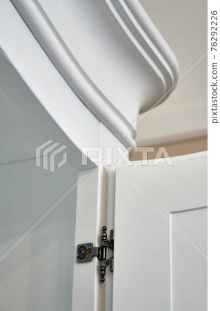 White wardrobe in classical style closeup White wardrobe in classical style closeup 76292226