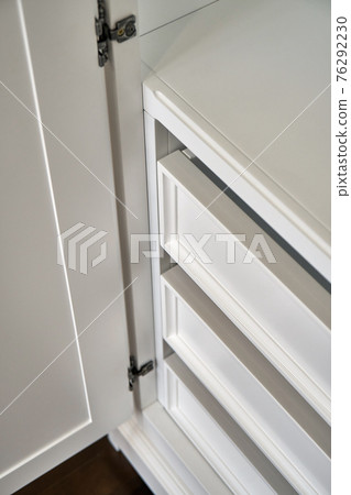 White wardrobe in classical style isolated on dark grey White wardrobe in classical style isolated on dark grey 76292230