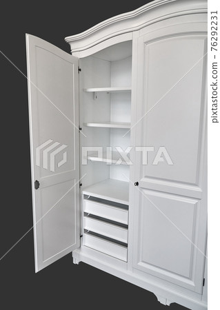 White wardrobe in classical style isolated on dark grey White wardrobe in classical style isolated on dark grey 76292231